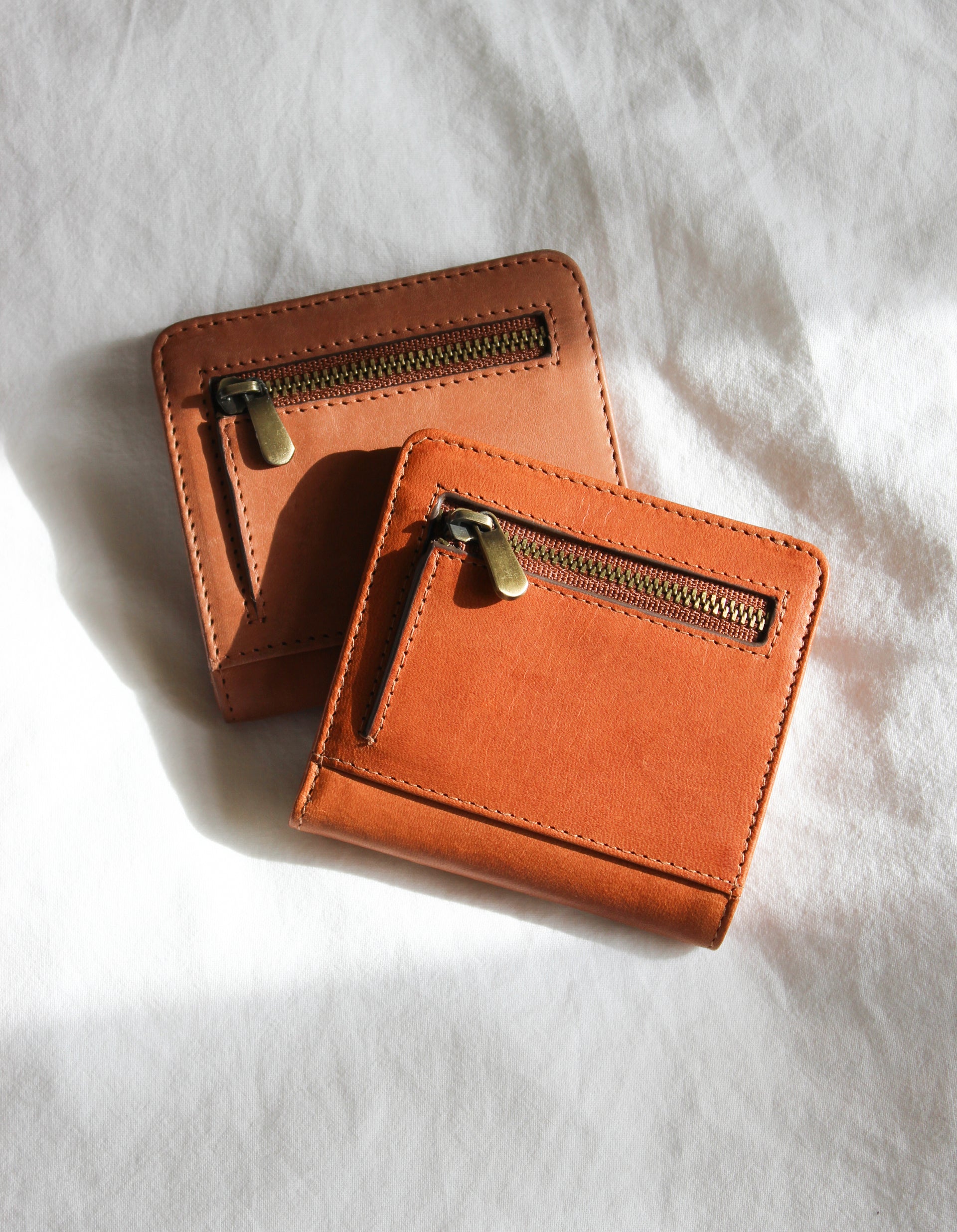 Alex's Fold-over Wallet Classic Leather cognac colour. Medium size, square shaped wallet, lifestyle image