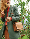 Audrey Apple Vegan Leather Cognac Rectangle Ladies Handbag, Model image.