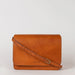 Audrey crossbody bag in cognac classic leather. Ft. adjustable leather strap. Front product image