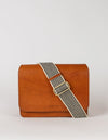 Audrey crossbody bag in cognac classic leather. Ft. checkered webbing strap. Front product image.