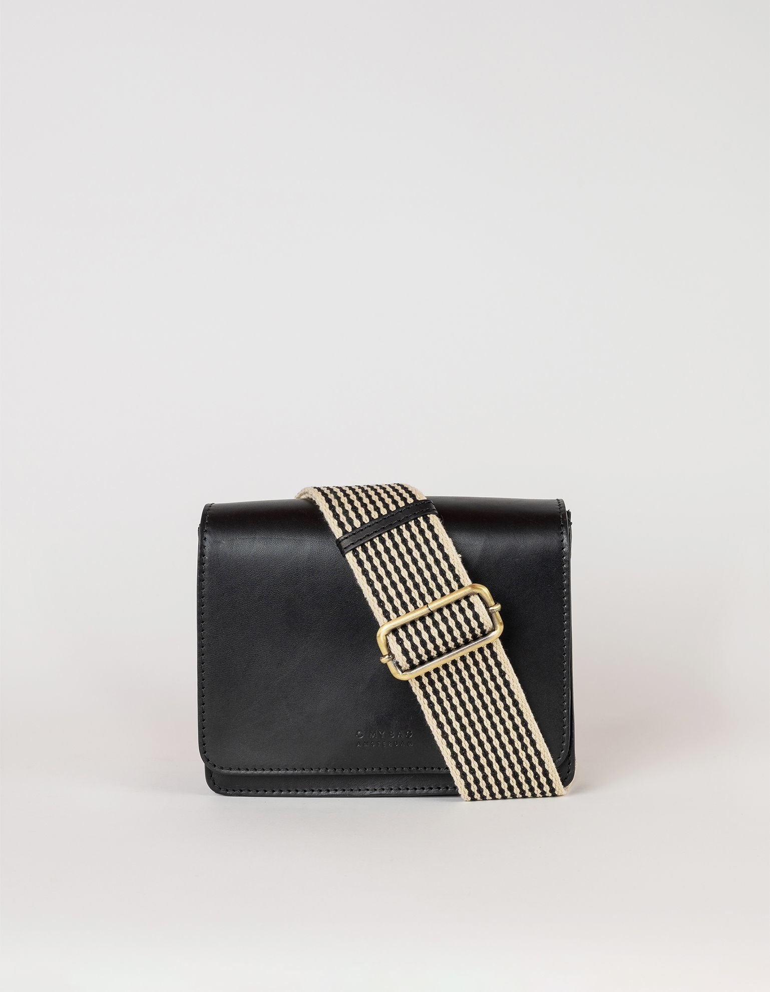 Audrey mini black classic leather bag. Front product image. With webbing strap.