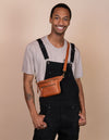 Wild Oak Croco Leather fanny pack. Square shape with an adjustable strap. Male product image.