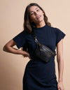 Black Croco Leather fanny pack. Square shape with an adjustable strap. model product image