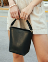 Small Black Bucket bag. Removable straps. Lifestyle product image