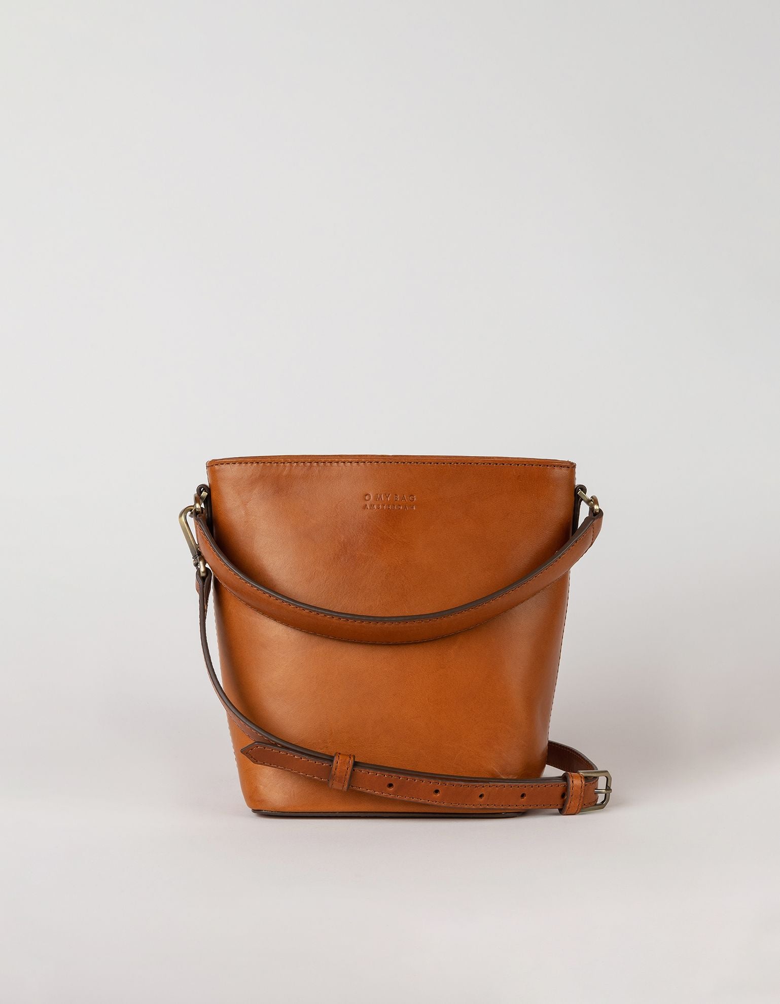 Small Cognac Bucket bag. Removable long strap. Front product image