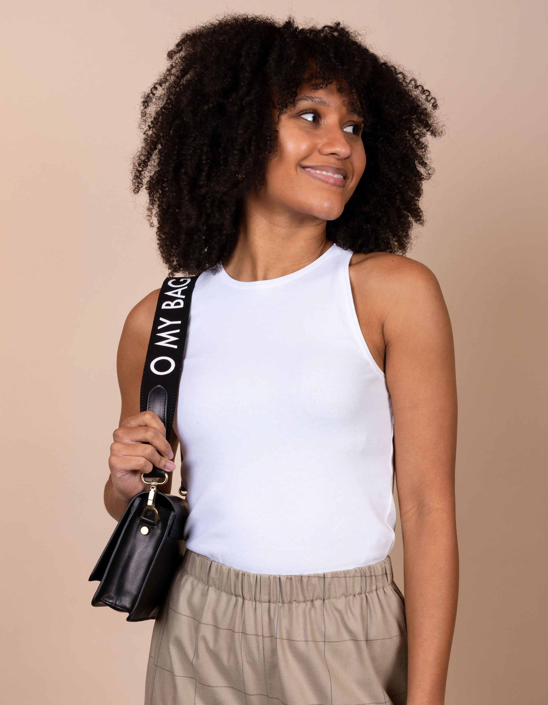 Canvas O My Bag Logo Strap in black. Model image, styled with Audrey Mini - second product image