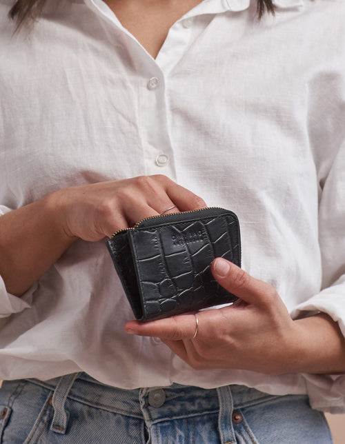 Small Black Croco coin purse. Square shape. Model image