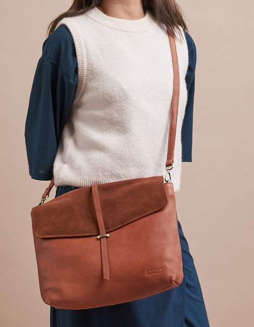 Wild Oak Soft Grain & Suede leather womens handbag. Square shape with an adjustable strap. Model product image.