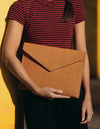 Cognac Leather 13'' laptop sleeve. Lifestyle image.
