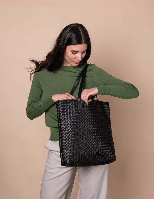Model with Georgia bag in black woven classic leather