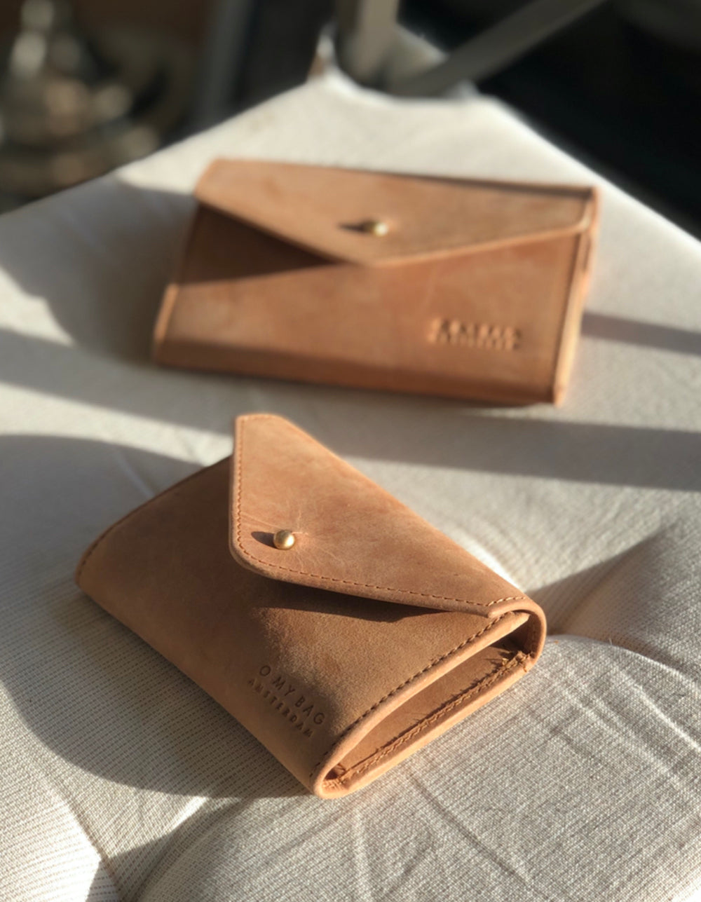 Camel Leather wallet. Envelope shape. Lifestyle product image.