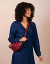 Laura Bag in Ruby Classic Leather ft. Checkered Webbing Strap - Female model product image - front view