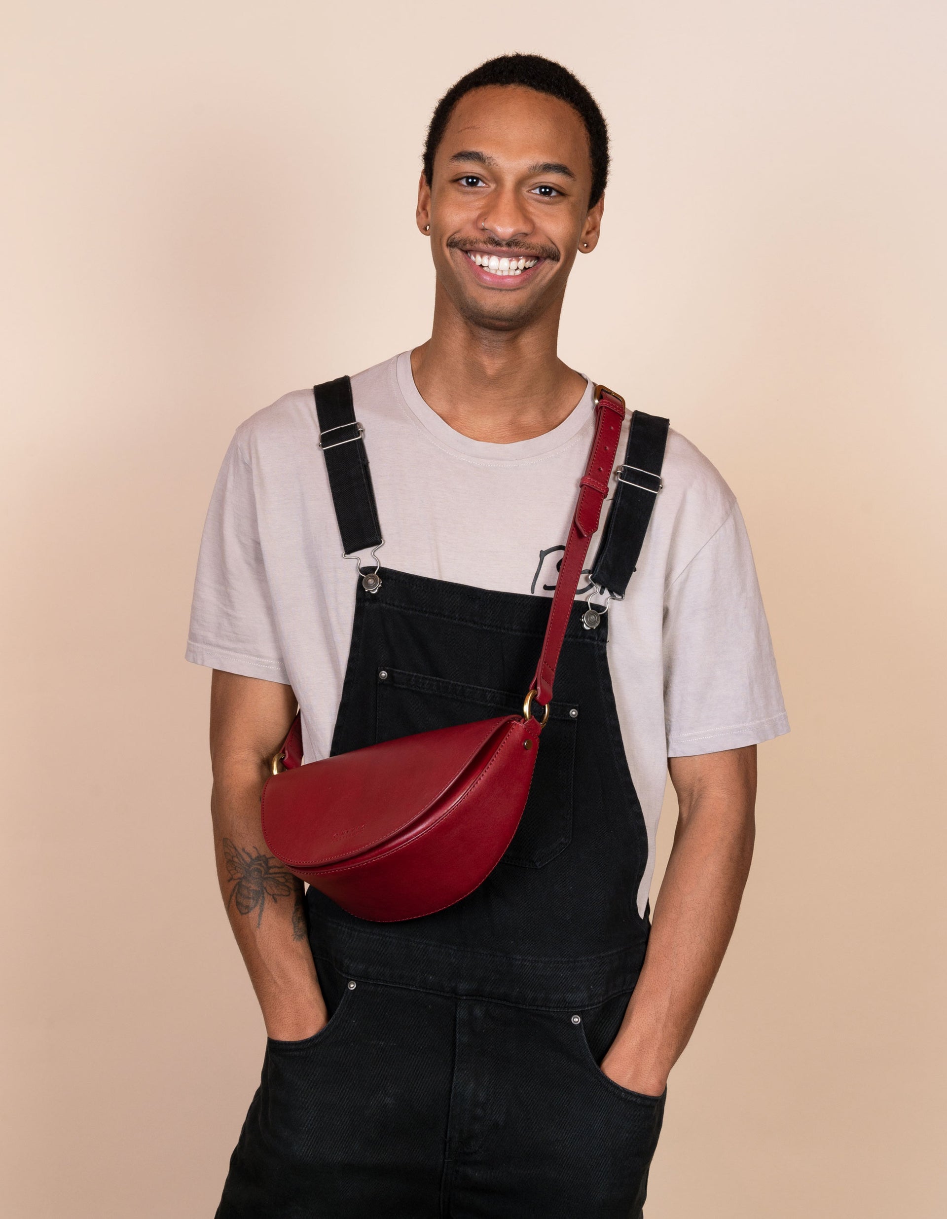Laura Bag in Ruby Classic Leather ft. Adjustable leather strap - Male model product image