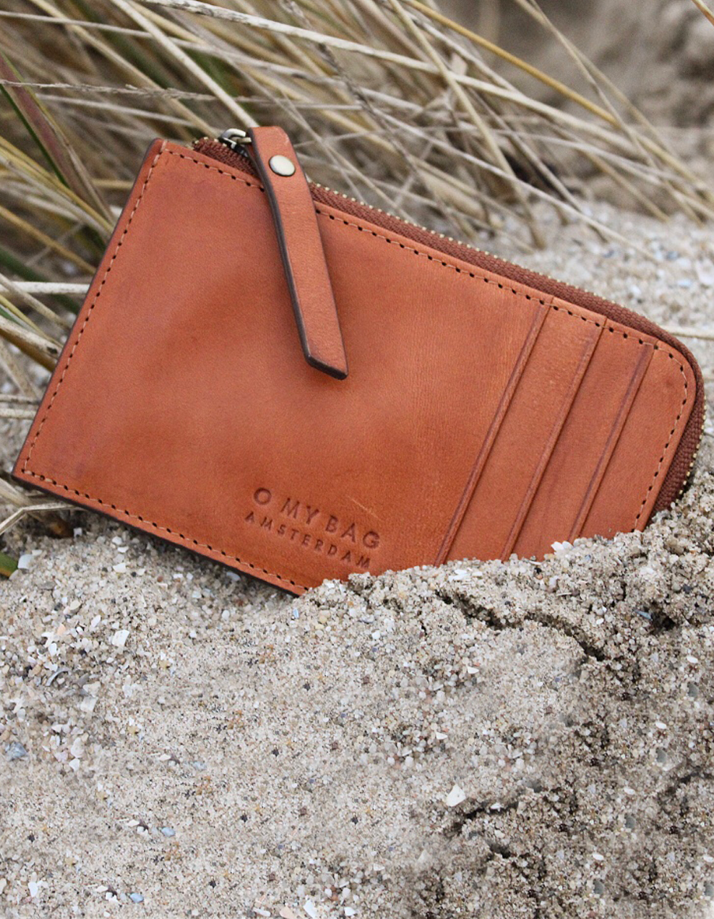 Lola Coin Purse Cognac Leather. Small purse. Lifestyle image
