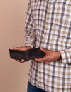 Tobi's wallet in black classic leather. Male model product image, inside wallet shot.